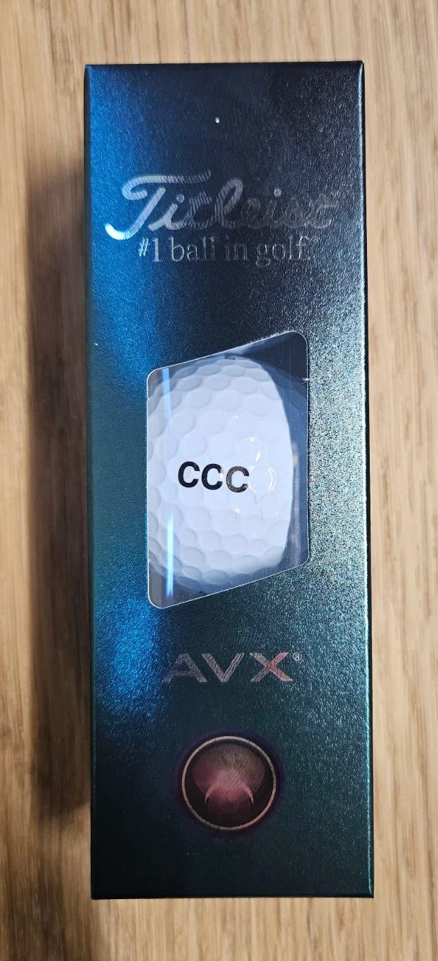 Titleist AVX golf balls, black text: CCC