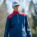 Golfer wearing Ping AquaDrive Half-Zip jacket in action