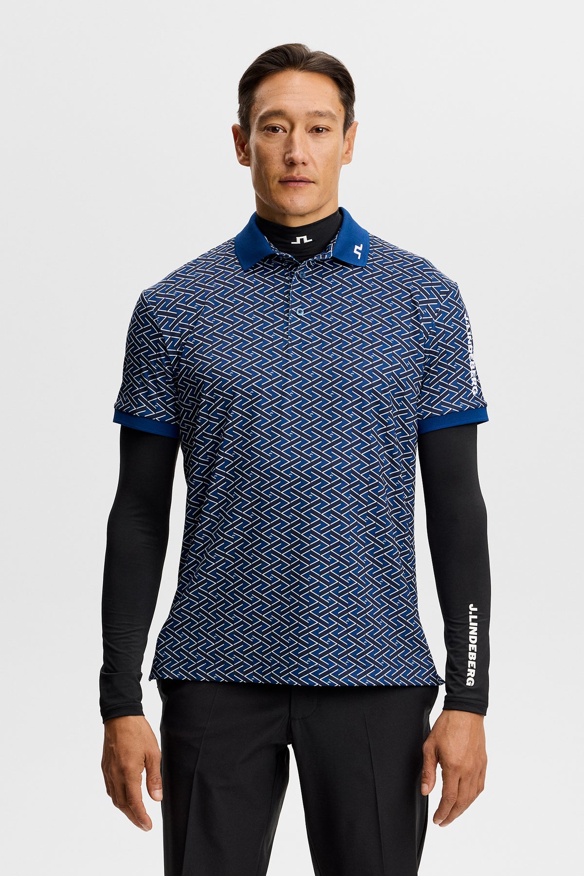 J.Lindeberg Tour Tech Print Polo Ladder Estate Navy - on-course lifestyle