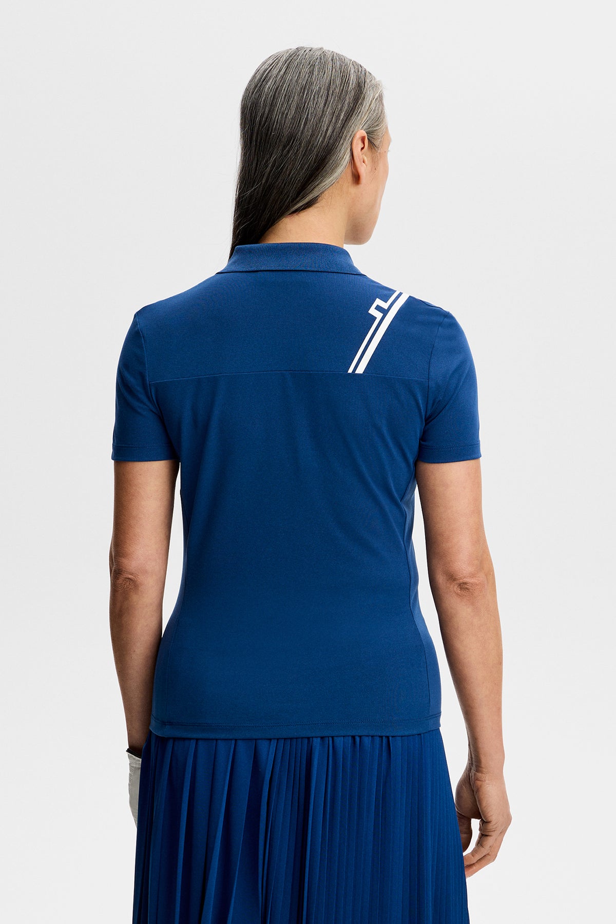 J.Lindeberg Melli Polo Estate Blue - lifestyle on course