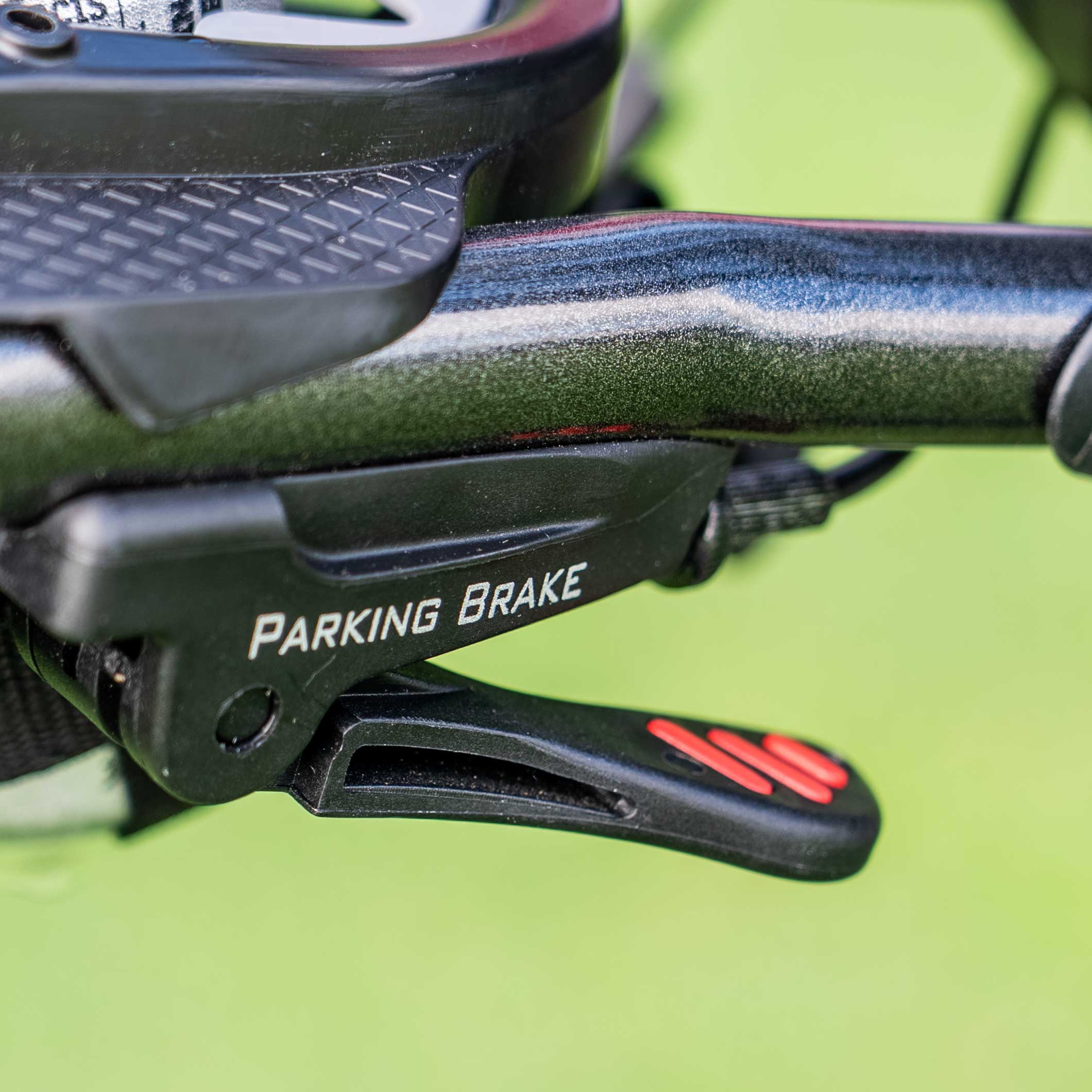 Bag Boy Slimfold — handle-mounted parking brake