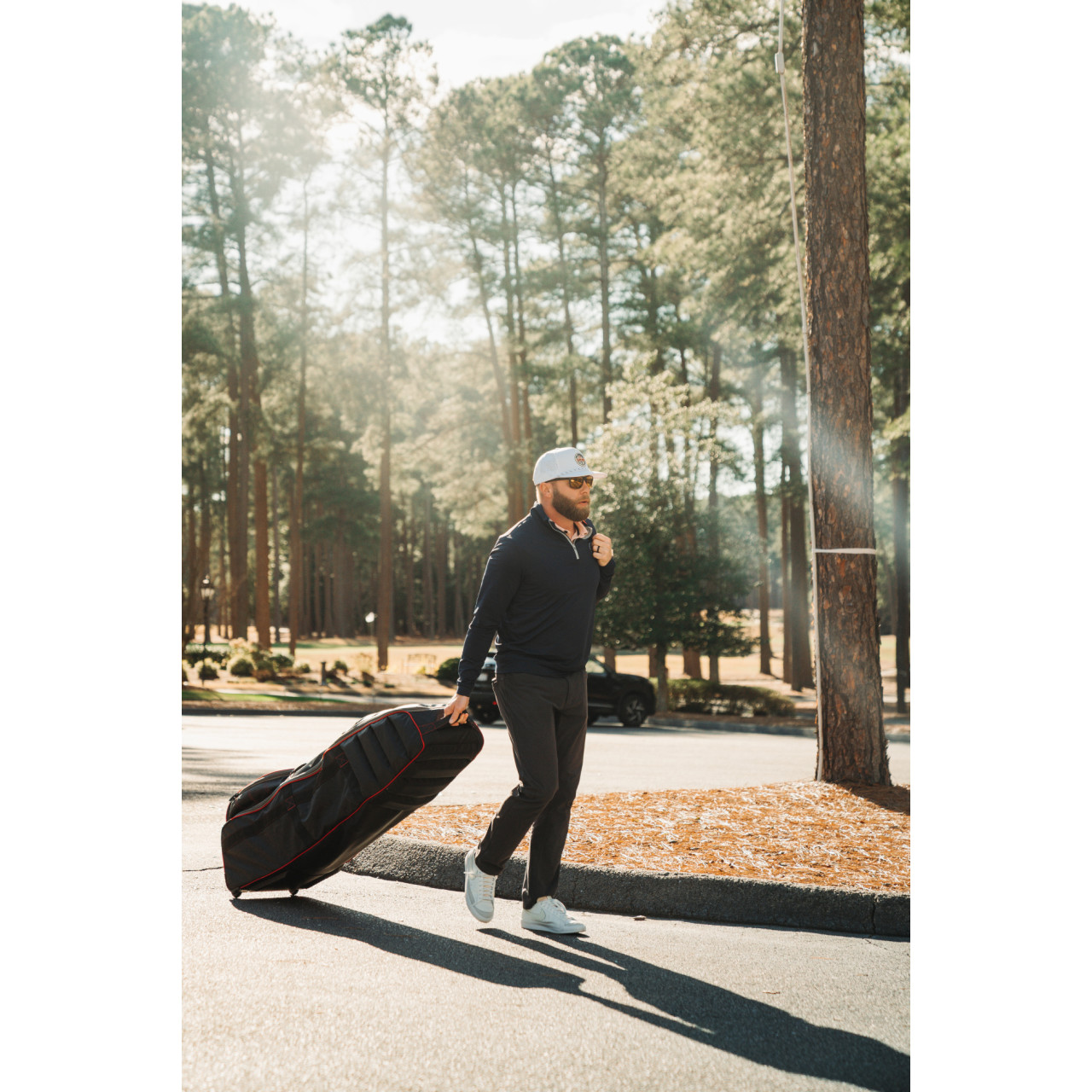 Bag Boy T-800 Travel Cover — wheels and handle in action