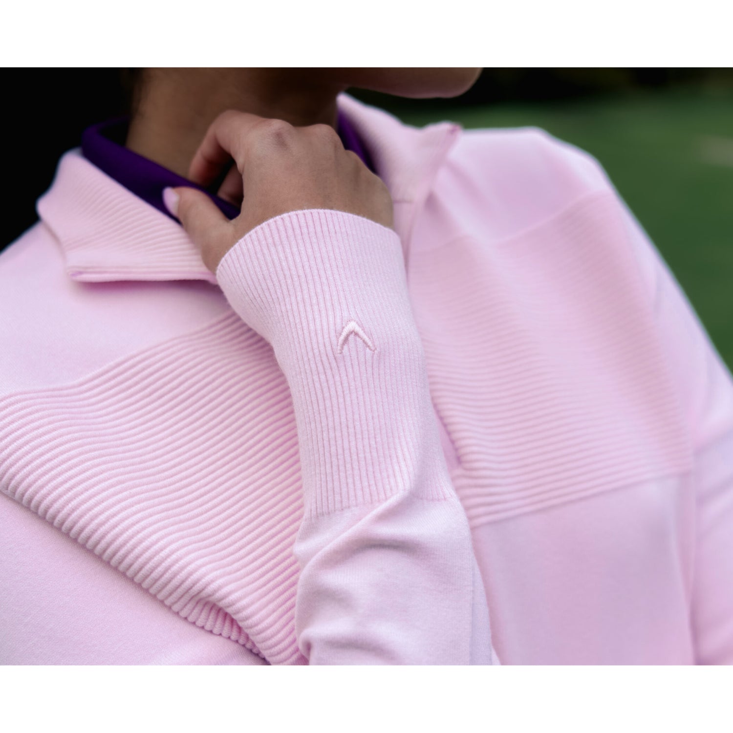 Close-up of the ribbed knit texture on the Callaway Soft Stretch Zip-Neck Sweater in Cherry Blossom