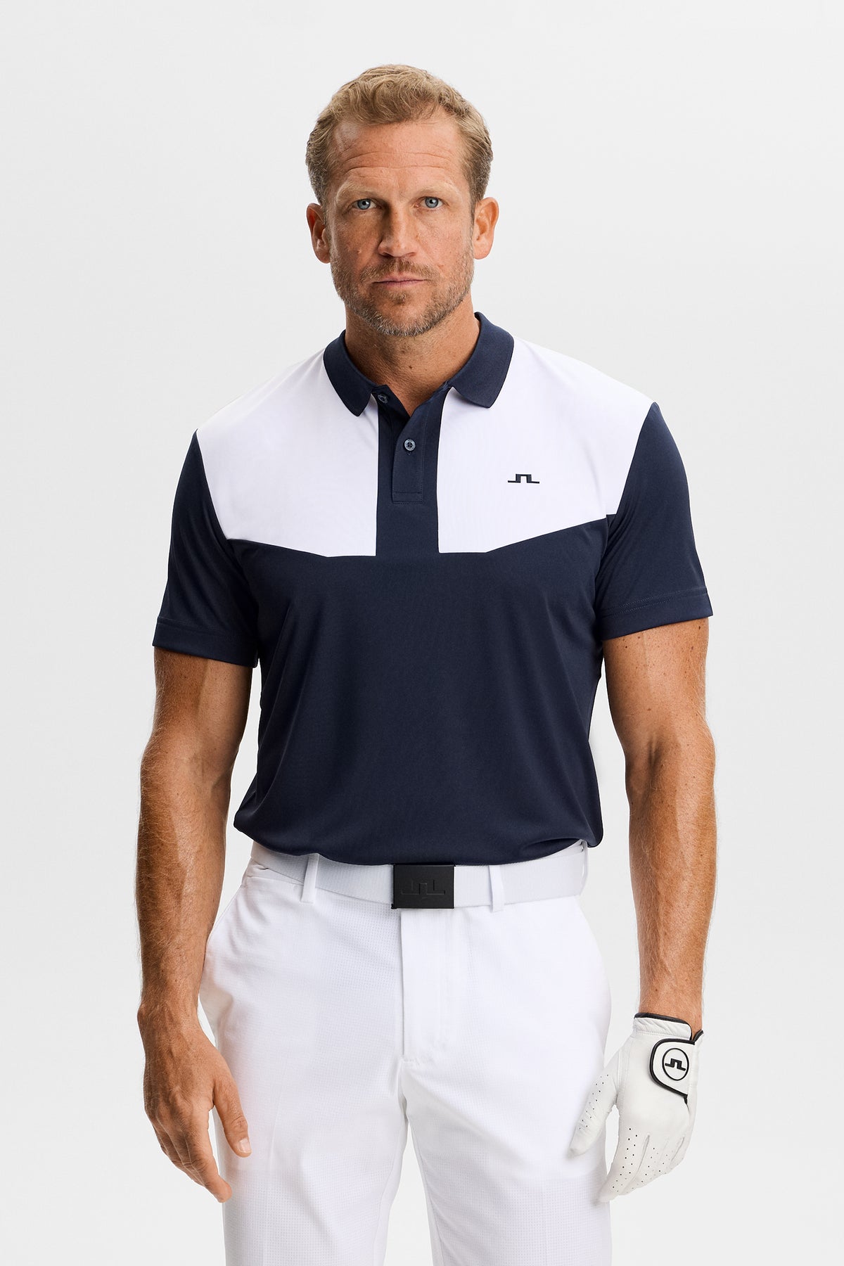 J.Lindeberg Calex Polo JL Navy – front view showing contrast chest panels and Bridge logo