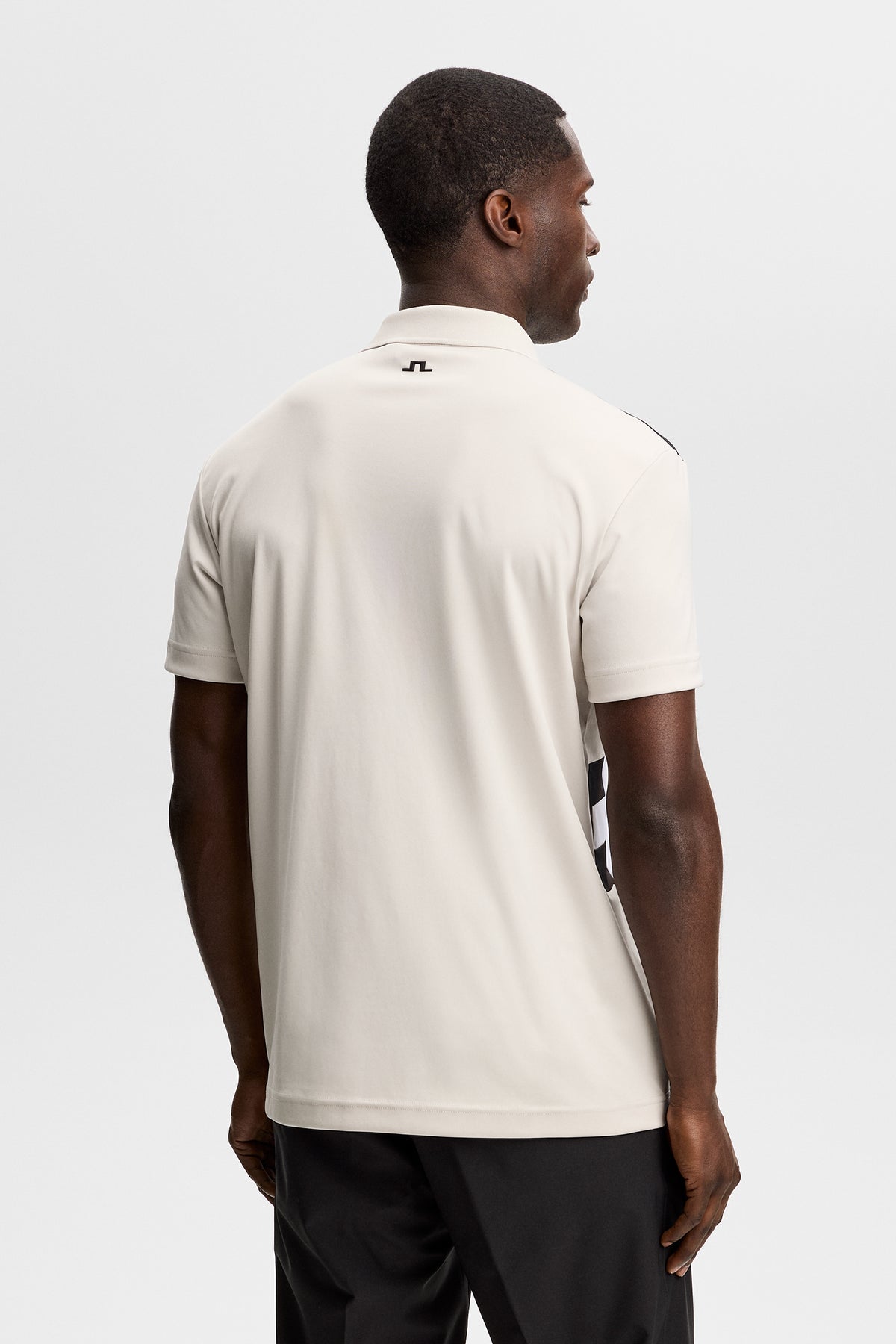 J.Lindeberg Finn Polo Moonbeam back detail showing cut-and-sewn contrast side panels
